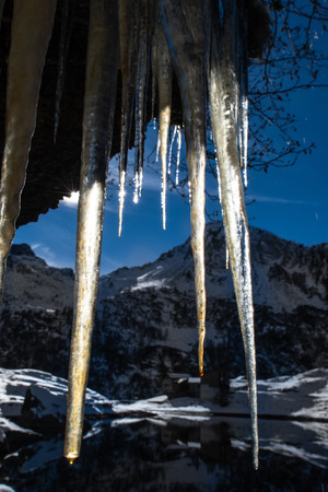 Stalactites ice in the mountains lluminated by the sun.の写真素材
