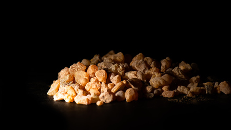 A bit of grain incense on a black background.の写真素材