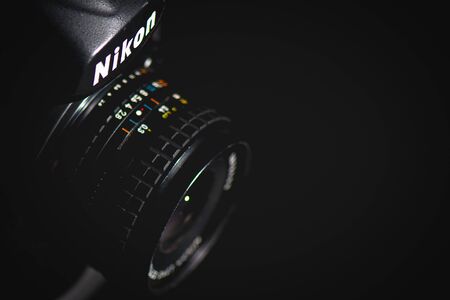 San Pellegrino terme, Italy - October 1, 2019:  Detail of a Nikon SLR on a black backgroundのeditorial素材