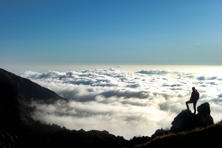 Look at the horizon in a sea of clouds from the top of the mountainsの写真素材