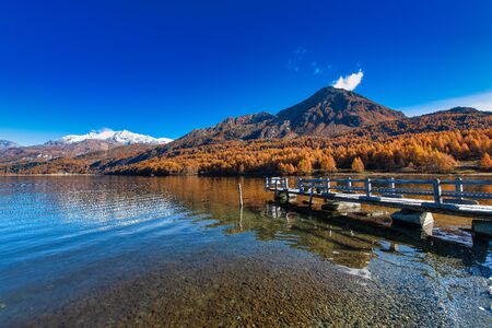 Small pier on the mountain lake in the Swiss Alpsの写真素材