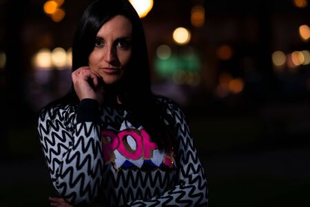 Portrait of 80s style woman at night