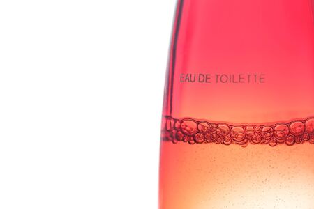 Bubbles in a flask of eau de toilette on a white backgroundの写真素材