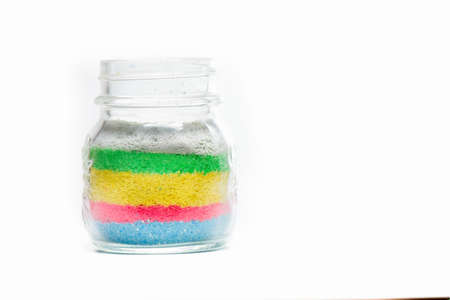 Glass jar with colored sandの写真素材