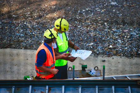 San Pellegrino terme, Italy, 09.08.2020: Worker walks on a construction siteのeditorial素材