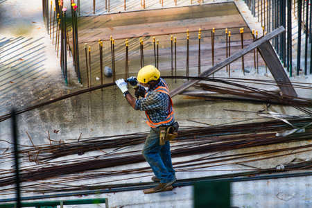 San Pellegrino terme, Italy, 09.08.2020: Worker walks on a construction siteのeditorial素材