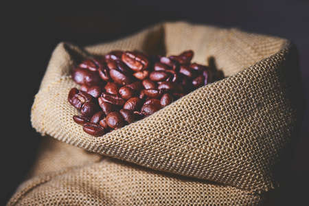 Some coffee beans ranging from in focus to slightly out of focusの写真素材