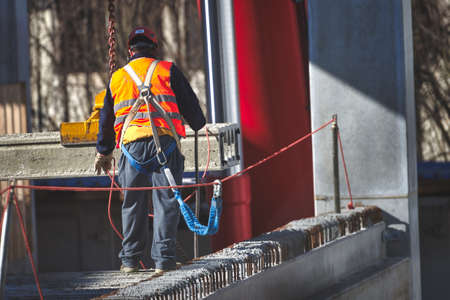 Worker on construction site with work safety system