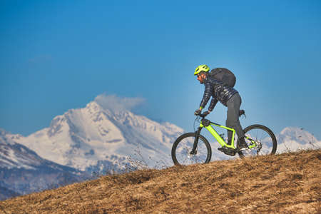 Mountain bike excursion in the mountains on the meadowsの写真素材