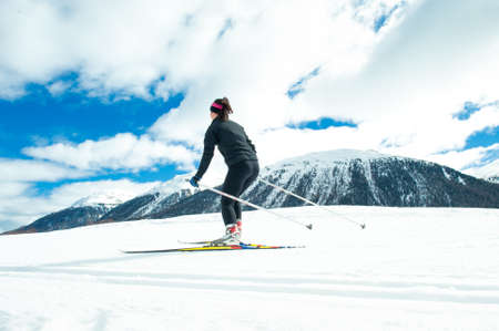 A young woman practicing Nordic skiing