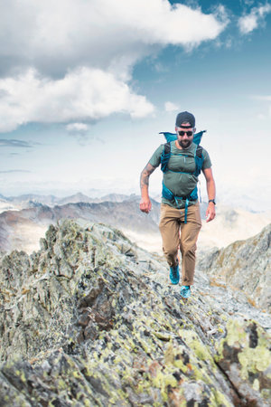 Man on alpine ridges in the mountains of northern Italy