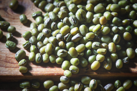 Detail of green beans seed  on woodの写真素材