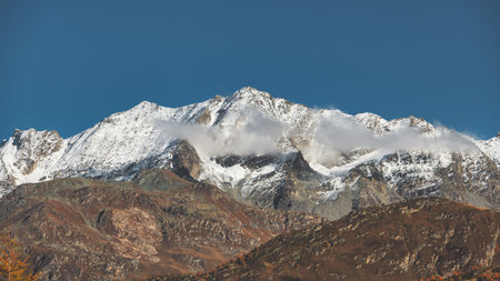 Alpine landscape on Swiss alps with first snow in altitudeの写真素材