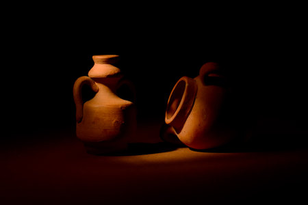 Terracotta amphorae on dark backgroundの写真素材