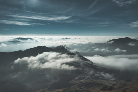 Horizontal abstract mountain landscape with clouds and mistsの写真素材