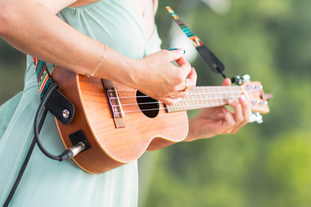 Play the Ukulele detail of a girlの写真素材