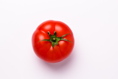top view of an isolated tomato on white backgroundの写真素材