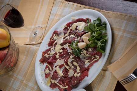 carpaccio with rucola, parmesan cheese and mayonnaise sauceの写真素材