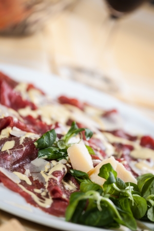 carpaccio with rucola, parmesan cheese and mayonnaise sauceの写真素材