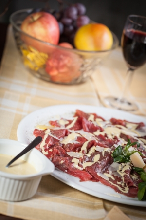 carpaccio with rucola, parmesan cheese and mayonnaise sauceの写真素材