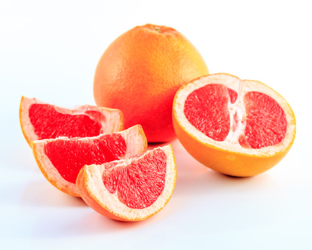 Slice grapefruit isolated on white backgroundの写真素材