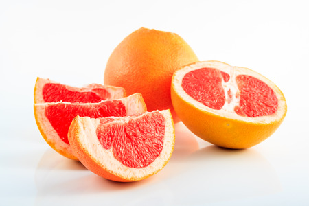 Slice grapefruit isolated on white backgroundの写真素材