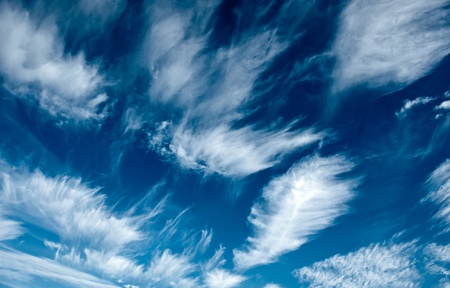 Evocative image of clouds in the blue sky of a beautiful dayの写真素材