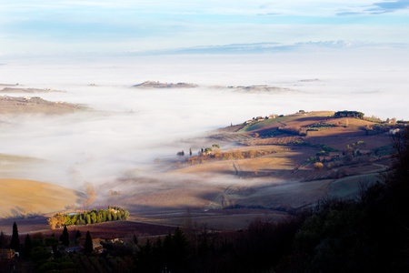 Tuscan landscape in the fog, Montepulciano (Italy). の写真素材