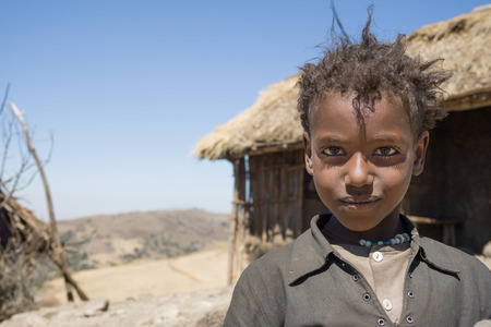 BALE MOUNTAINS, ETHIOPIA - JANUARY 3, 2009: Young girl posing for a picture in the mountains near Dinsho on January 3, 2009 in Bale Mountains, Ethiopia.のeditorial素材