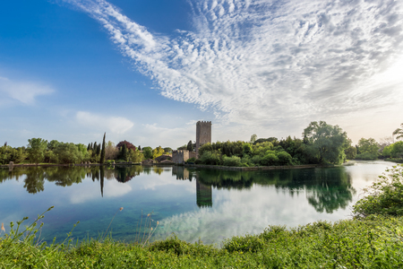 View of the historic castle and spectacular lake of the Ninfa Garden in the province of Latina, Italy, Europe.のeditorial素材