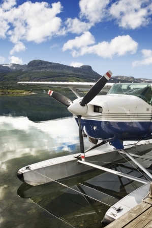 Seaplane in norway lake with mountain background