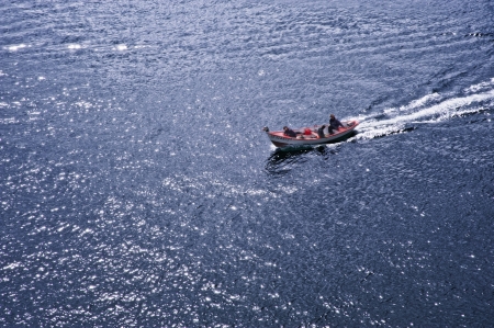 Fisherman's boat in blue ocean