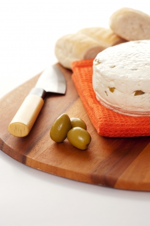 homemade chees with olives against white backgroundの写真素材