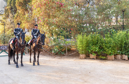 Syracuse Sicily Italy - july 22 2021: Two proud carabinieri on horseback inside the archaeological park of Neapolisのeditorial素材