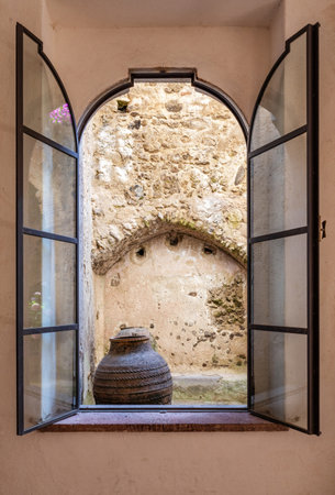 Naples, Ischia, Italy - July 05 2021: Window overlooking the courtyard of the Aragonese castle of Ischia, Naples, Italyのeditorial素材