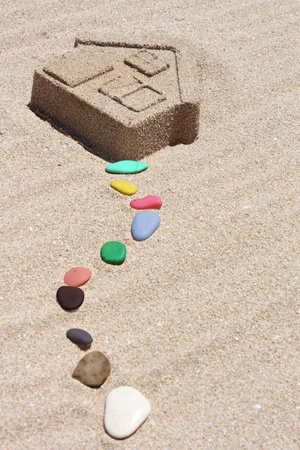 House of sand and colored stonesの写真素材