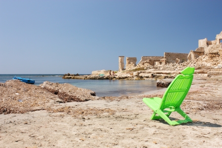 Natural beach and deckchairsの写真素材