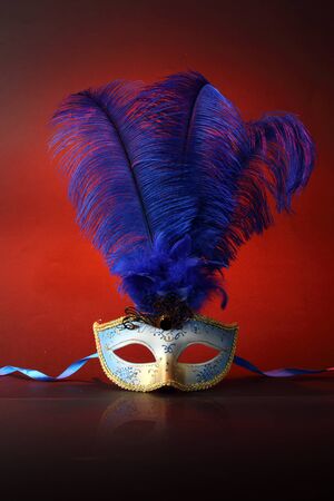 Beautiful masks on wooden tableの写真素材