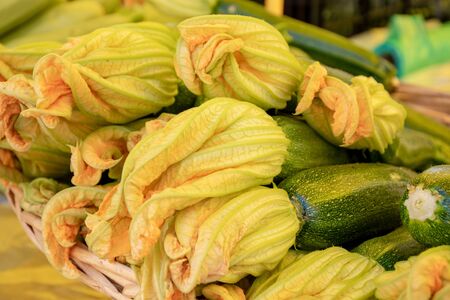 Fresh courgettes flower or courgettes in a farmer agricultural open air market, seasonal healthy food. Concept of biological, bio products, bio ecology, grown by yourself, vegetariansの写真素材