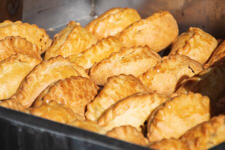 Kibinai, traditional Lithuanian food, filled with various meat, onion and pepper, popular with Karaite ethnic minority in Trakai, Lithuania, street food marketの写真素材