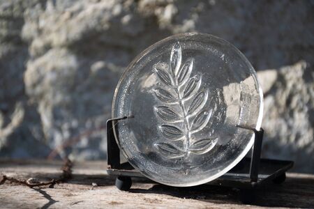 Leaf carved on a piece of glassの写真素材