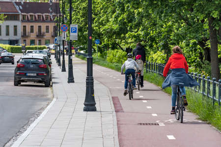 Vilnius, Lithuania - May 29 2020: Family cycling on the road bike during Covid or Coronavirus emergency, sustainable transport conceptのeditorial素材