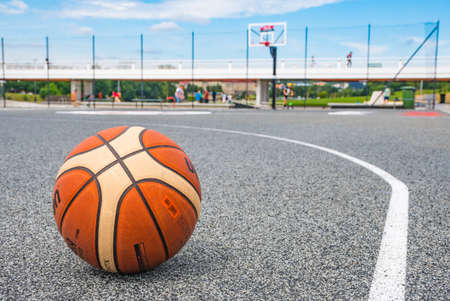 Basketball ball on asphalt field close up, street basketball in the cityの写真素材