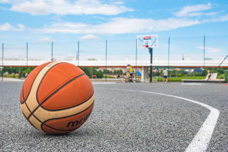 Basketball ball on asphalt field close up, street basketball in the cityの写真素材