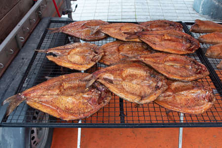 Smoked fish on a farmer's street market in Vilnius, Lithuania, ready to eatの写真素材