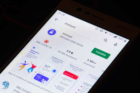 Roma, Italy - October 7 2020: Stop Covid, Immuni App, official COVID-19 or Coronavirus contact tracing app for Italy, Italian Government's exposure notification solution, tracking system, downloadのeditorial素材