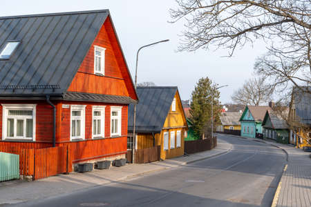 Trakai, Lithuania - April 10 2021: Old Lithuanian traditional green wooden houses with three windows in Trakai, Vilnius district, Lithuania, Europeのeditorial素材
