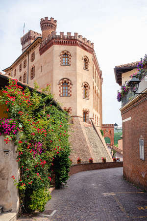 Medieval castle of Barolo, Piemonte, Langhe wine district and Uneso heritage, Italy with Italian flag, verticalのeditorial素材