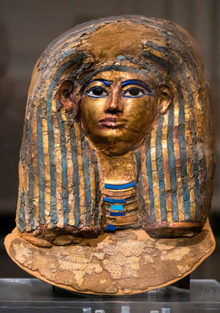 Torino, Italy - September 6 2021: Close up funerary mask of Merit Ptah, an early physician in ancient Egypt (1550 to 1292 BC), made by cloth, linen, plaster, gold leaf, glass, Turin, Italy, Egyptianのeditorial素材