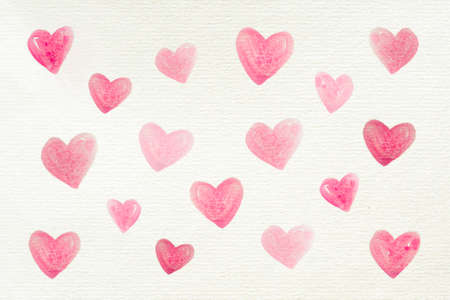 Love background with many watercolor hearts painted on a recycled white paper for Valentine's Day or other celebrations, letter, copy spaceの写真素材